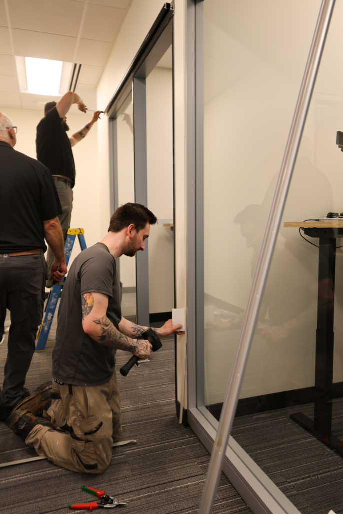 Systemcenter Alaska installation team building Haworth Enclose modular wall glass store fronts at Edward Jones Anchorage Office in SIRI building