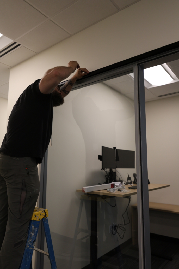 Systemcenter Alaska installation team building Haworth Enclose modular wall glass store fronts at Edward Jones Anchorage Office in SIRI building